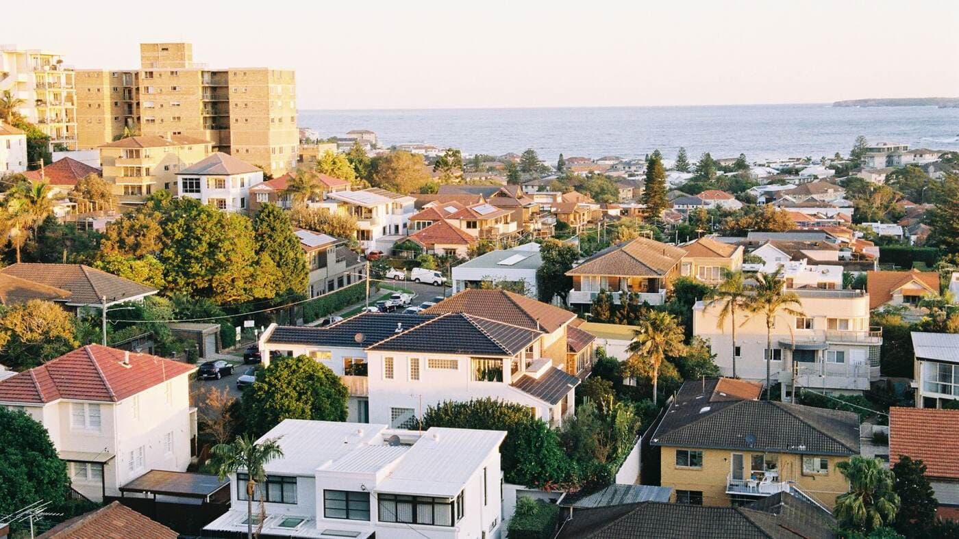 Aerial view of coastal homes along the shoreline